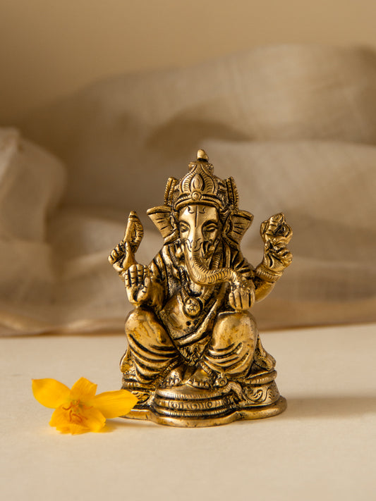 Brass Ganesha Sitting on a Decorative Base